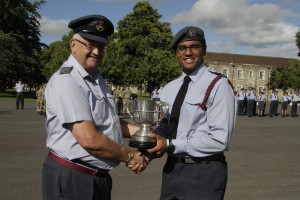 CWO Grey receiving the trophy from Wng Commander Cox